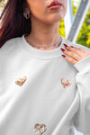 Sudadera corazones dorados