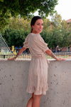 Vestido corto cruzado manga abombada.
